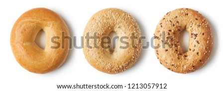 Set of fresh bagels isolated on white background, top view Royalty-Free Stock Photo #1213057912