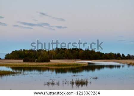 view on little island in evening ligth, baltic sea coast, Klamar, Sweden