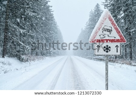 Winter Driving - Heavy snowfall on a country road. Driving on it becomes dangerous …