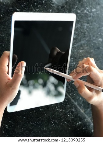 Man drawing on a tablet