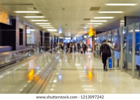 Airport corridor with passengers, defocus