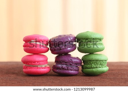  Colorful Macaroon on wooden table and background.