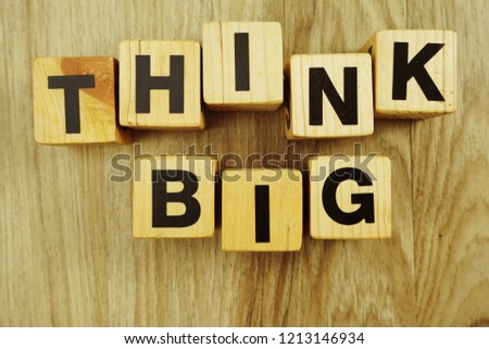 think big word made from wooden cubes with letters alphabet