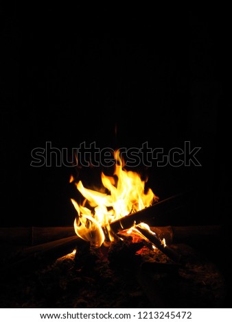 Warm campfire on black background at night. Travel, living, ritual inspiration motivation lifestyle concept