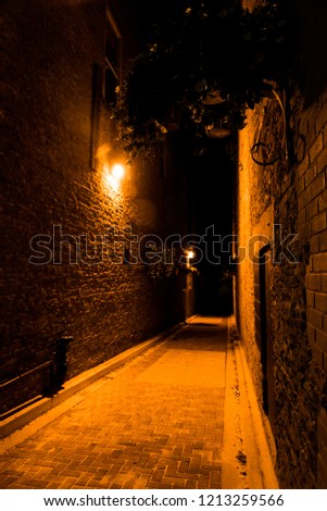 Dark Alley way Royalty-Free Stock Photo #1213259566