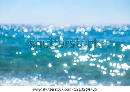 Abstract bokeh background of summer blue sea water at the beach