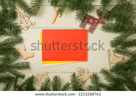 Christmas tree frame branches, envelopes and christmas toys on wooden background with copy space. Horizontal template for design