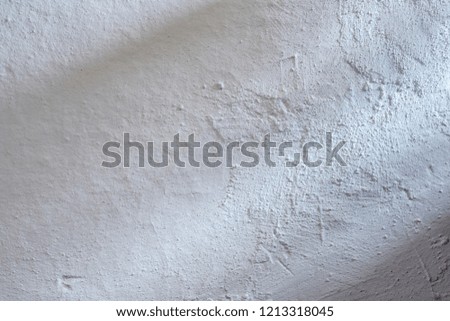 Closeup of an old wall plastered with lime in a rural home. Black and white texture, vintage, grunge, nostalgia.