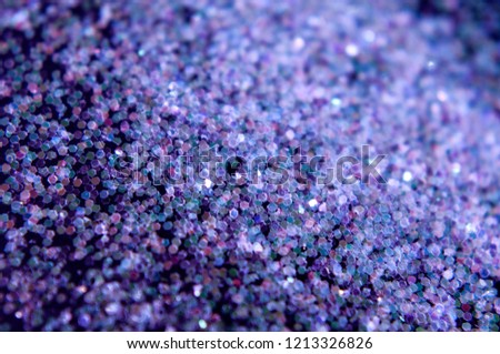 Purple glitter hexagons on a dark background. Flat lay. For Party invitation, christmas or new year celebration.