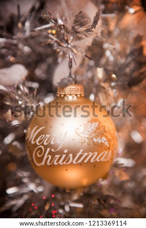 Merry Christmas Ornament Hanging on Tree
