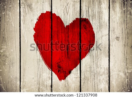 Love symbol on old wooden wall