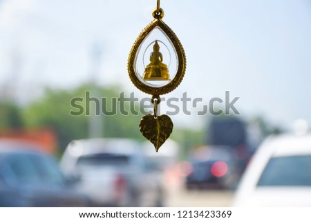Travelling with more car on the route to countryside, Traffic jam on the road, Buddha statue in front of car, blur of car on the way