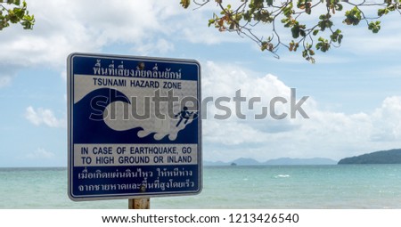 Tsunami Hazard zone sign with beach and islands in the background