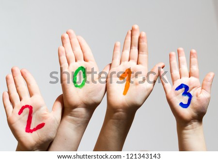 New Year 2013 - numbers on the hands Royalty-Free Stock Photo #121343143
