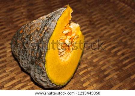 Fresh Pumpkin on wooden wicker