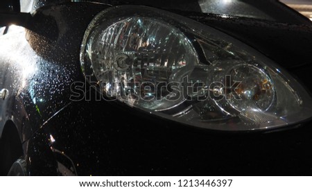 raindrops on car night time with lighting effect