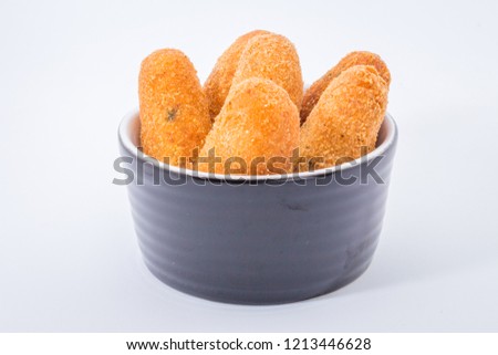 codfish fritters or codfish cakes, a traditional appetizer in Portugal on white background
