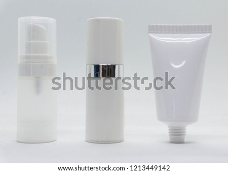 a white bottle with tube sample for product packaging shoot in the mini lightbox