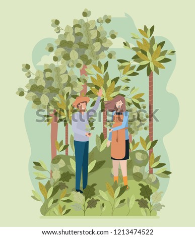 couple planting tree in the park