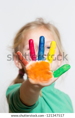 Little funny girl with painted hands