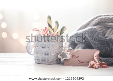 Christmas festive background with sweet gift for Santa in a beautiful cup, concept of holidays and family values
