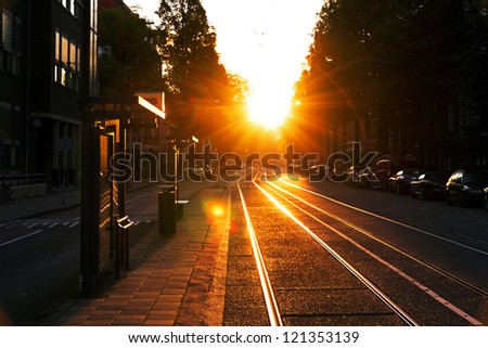 Early morning, waiting at the bus stop in Amsterdam, Netherlands Royalty-Free Stock Photo #121353139