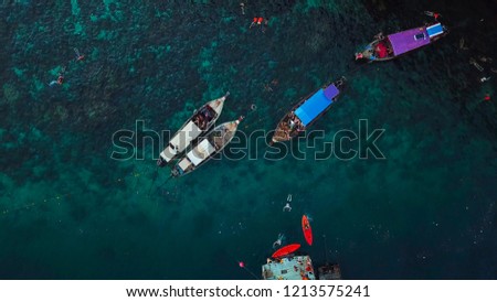 Long-tail boat anchoring above reef, top view, Thailand	