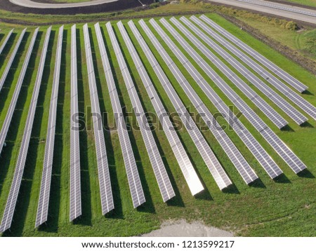 Aerial view of solar panels plant. Concept of clean and renewable energy.