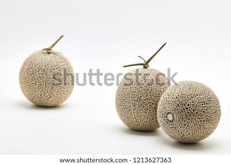 Three fresh cantaloupe melons on white background, Space for design