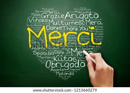 Merci (Thank You in French) love heart Word Cloud on blackboard, all languages