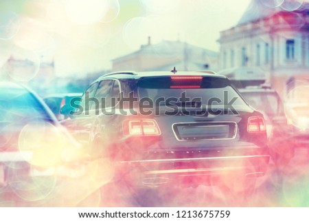 abstract traffic jam background on road / bokeh, view of transport, auto on the road in blurred background, cars, rear light, stop signal