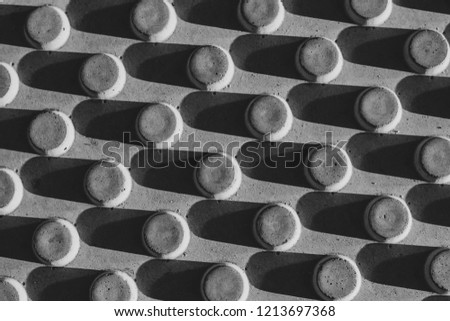 black-and-white image of the texture of the barrier with beautiful shadows as background abstraction