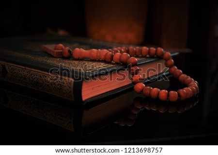 The holy Quran with tasbih/rosary beads Royalty-Free Stock Photo #1213698757