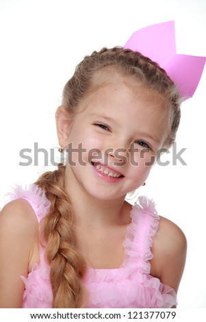 Close up image of beautiful young princess with pink crown dancing on Holiday theme over white background/Adorable little princess in pink dress