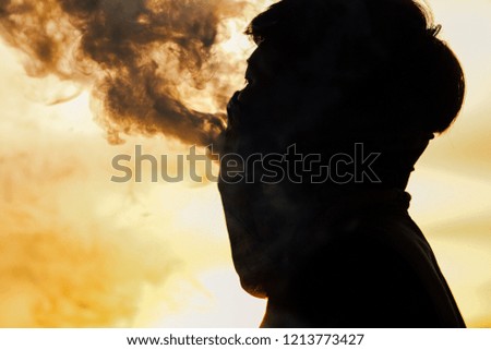 Silhouette shot man smoking 