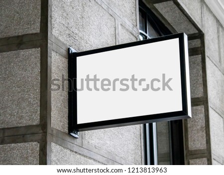 White square signboard on the wall