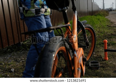 Boy with bycicle starting to ride