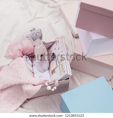 gift boxes, bunny is in a box with a blanket