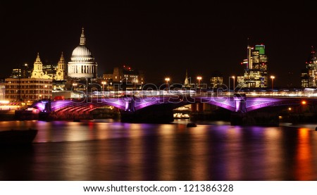 illuminated Blackfriars bridge in London at night
