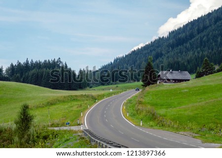 A picturesque asphalted mountain road through the Alps. Austria.