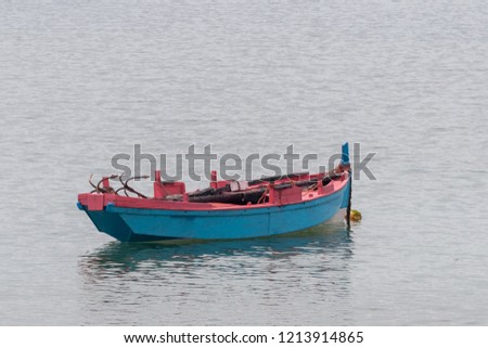 wooden fishing boat anchored