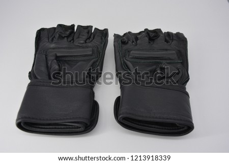 Black men's leather gloves for sport and training, sporting events, boxing and mixed sports, sport and the power of men