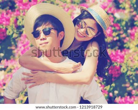 Asian Couple lover in traveler concept in the garden.