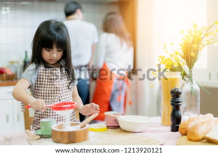 sweet family weekend activities cooking together with dad mom and daughter happiness moment and joyful hobby home kitchen background