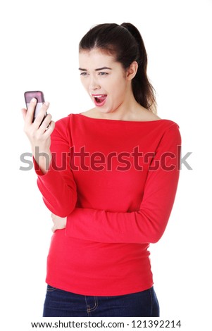 Teen girl using cell phone, isolated on white