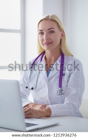 portrait of a young female doctor in a medical office
