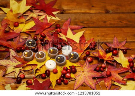 Candles and autumn leaves