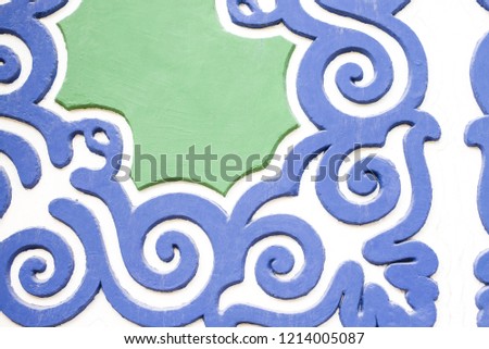 blue-green pattern on the wall, Oriental ornaments on the wall, blue-green ornament on the wall, decorative pattern on the wall
