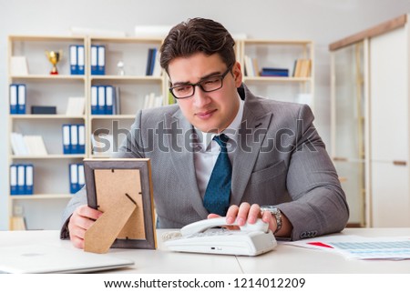 Businessman looking at the picture frame