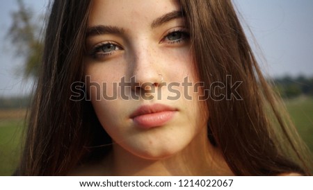 portrait of a beautiful 14 year old teenage girl with blue eyes